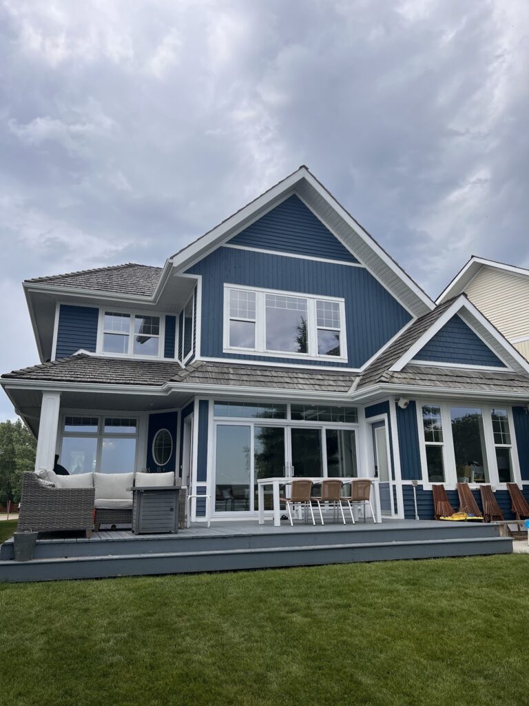 Rons painting red deer exterior navy blue two storey home
